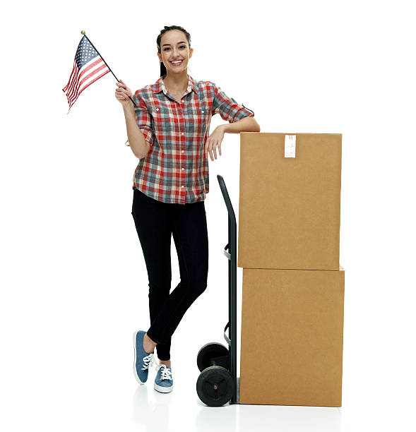 istock Smiling female holding American flag 579755120