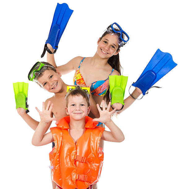 Three happy kids in diving mask standing together Three happy kids in diving mask standing together, isolated on white scuba diving family stock pictures, royalty-free photos & images