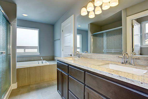 istock Lovely lavender bathroom with vanity cabinet and two sinks. 579756468