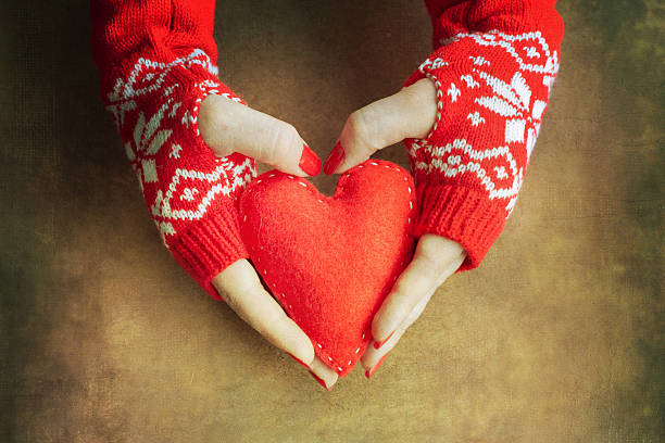 istock Christmas heart  in woman hands 579757244