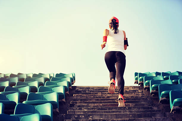 istock Runner athlete running on stairs. 579758180