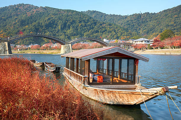 istock Boat and Kintai Bridge over Nishiki river in Iwakuni 579759910