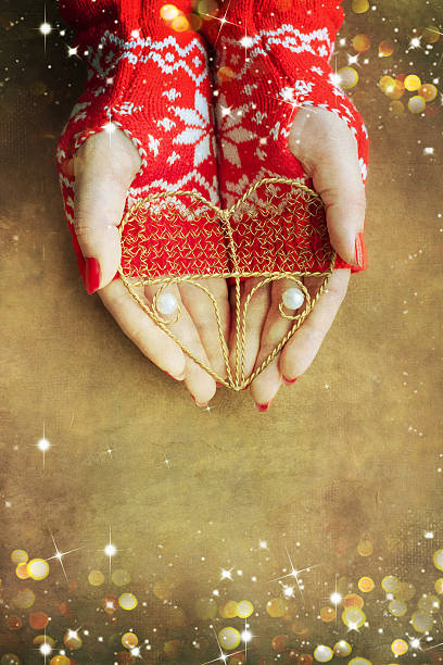 istock Christmas heart  in woman hands 579761584