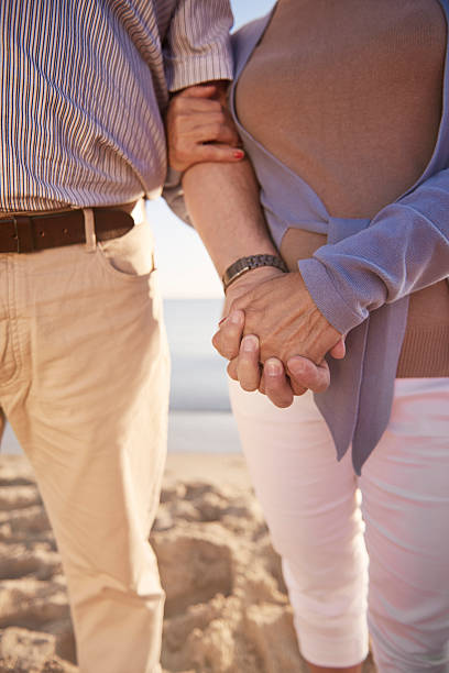 istock Close up of crossed human hands 579763328