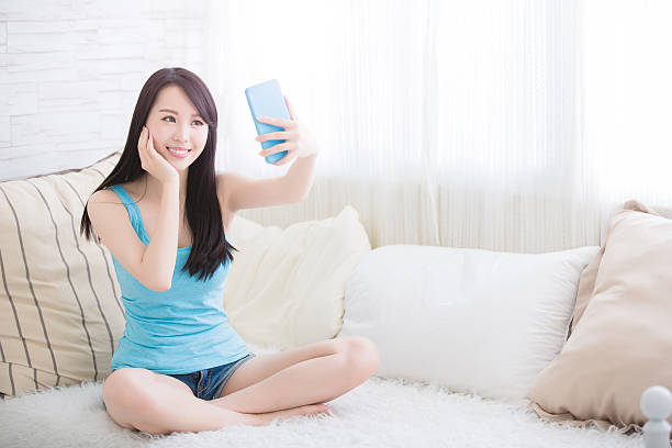 istock young woman is taking selfies 579764352