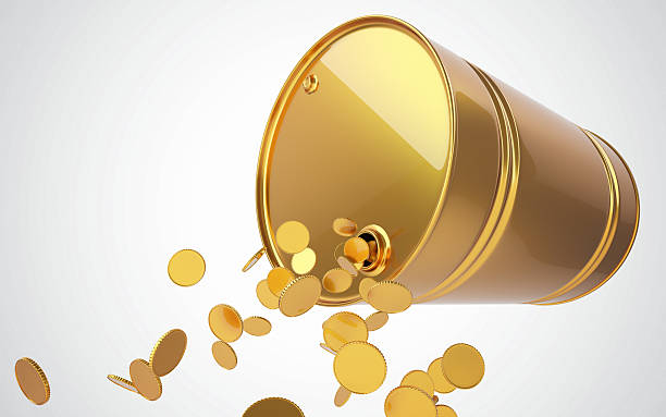 istock Golden barrel with coins 579764384