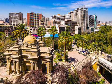 View of the buildings and the grounds of Santa Lucia Hill or Cerro Santa Lucia in Santiago, Chile. City buildings from the commercial area can be seen in the background.