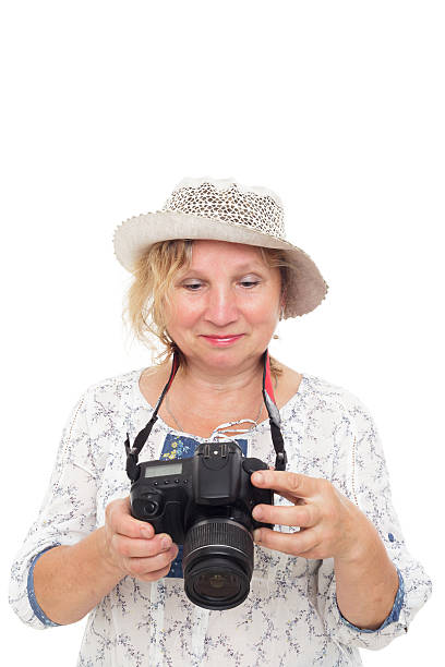 istock woman learns to hold  photocamera and understand settings 579765526