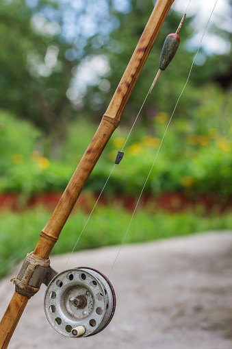 Old Fishing Rod On Nature Background Stock Photo - Download Image Now -  Catching, Equipment, Fisher - Role - iStock