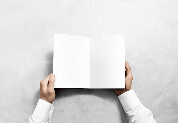 istock Hand opening blank white brochure booklet mockup. 579769134