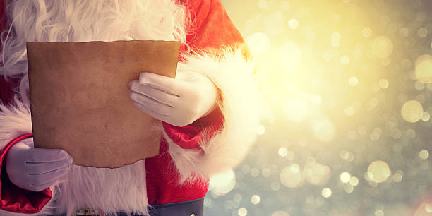 istock Santa Claus reading Christmas letter 579769476