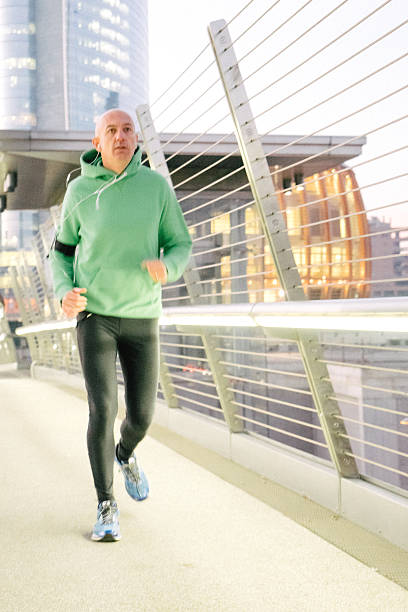 istock Mature Man Running Outdoors Wearing Sport Clothes 579770106