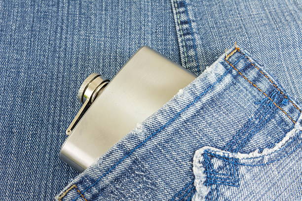istock Hip flask in denim jeans pocket 579770978