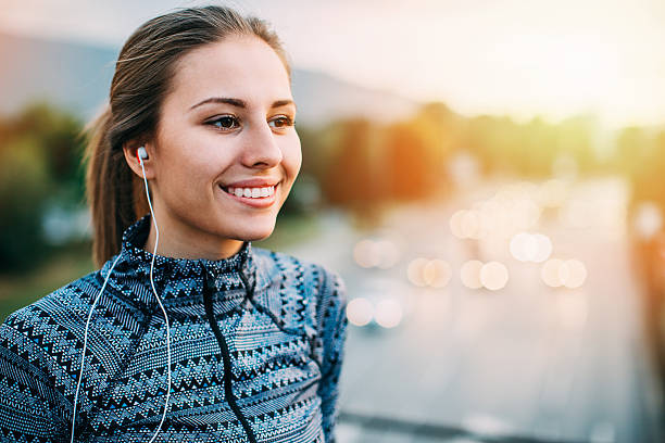 istock Sportswoman with headphones 579773736