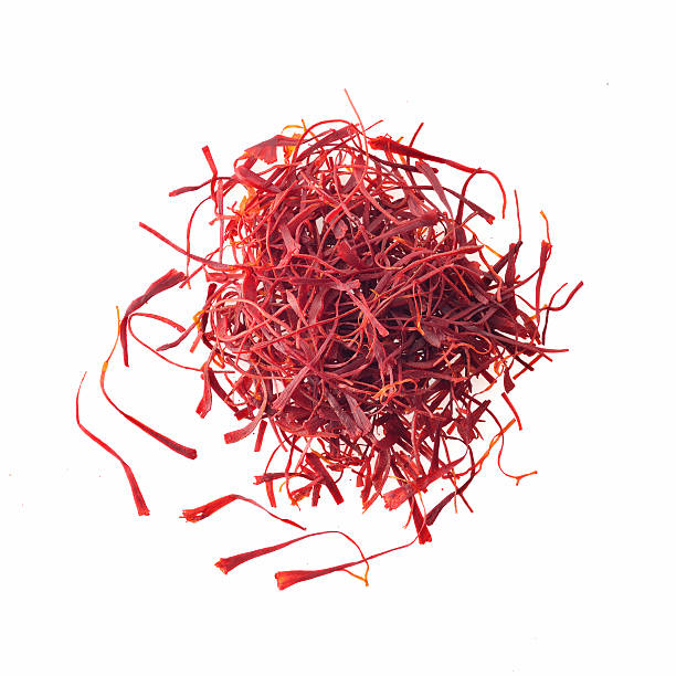 Top View of Red Saffron Threads on White Background High resolution image of red saffron threads shot in studio on white background pistil stock pictures, royalty-free photos & images