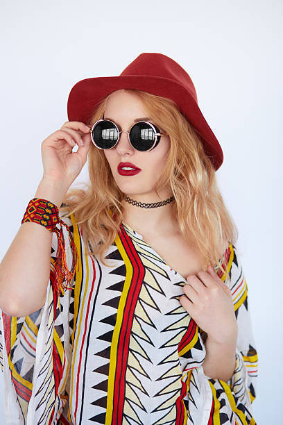 istock very pretty girl with sunglasses and red hat 579774468