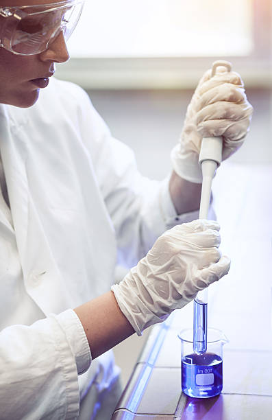 istock Pipetting into a test tube 579776330