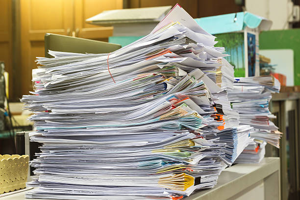 istock Stack of files full of documents signifying concepts 579777248