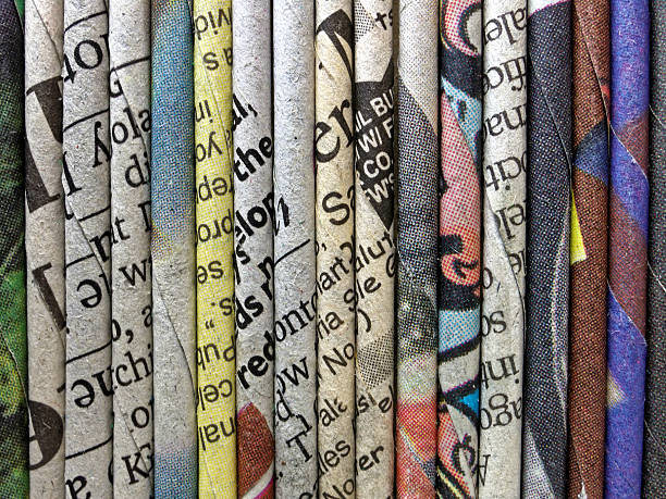 istock Many newspapers rolled and folded up lines up together 579777730