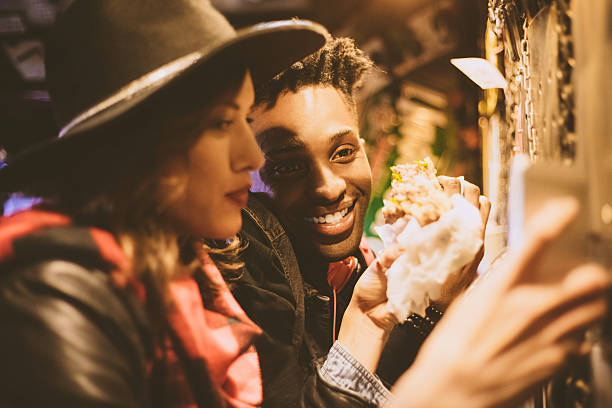 istock Multi ethnic couple in burger pub, close up of faces 579778204