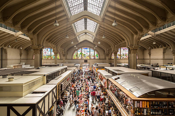 Sao Paulo, Brazil - March 15, 2014: People visiting the famous Municipal Market (Mercado Municipal) in Sao Paulo. Its a huge and bustling market with local fruit, vegetable, spice or condiment you could ask for.