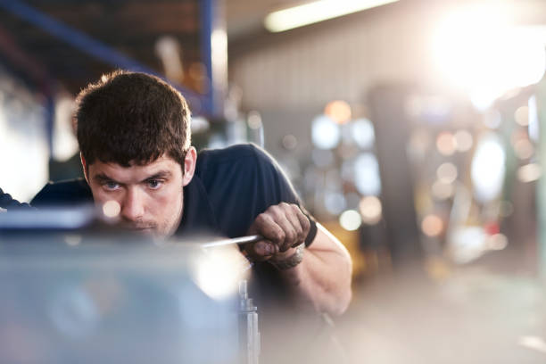 istock Mechanic working in auto repair shop 579980511