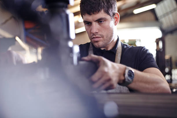 istock Focused mechanic working in auto repair shop 579980605