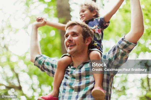 Father Carrying Son On Shoulders Below Trees Stock Photo - Download Image Now - 2-3 Years, 2015, 30-39 Years