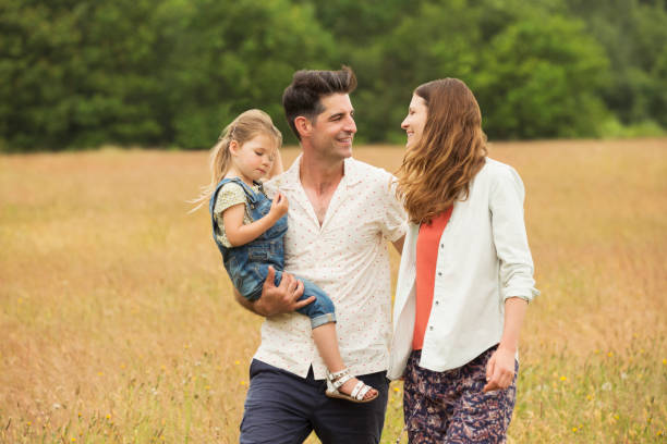 istock Family walking in rural field 579980699