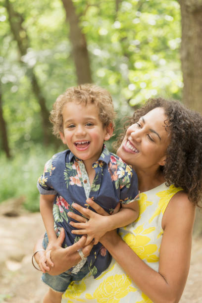istock Portrait enthusiastic mother and son in woods 579980815
