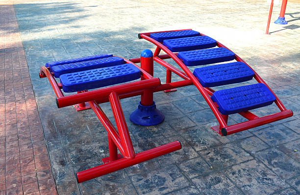 istock Colorful exercise equipment in public park 580089136