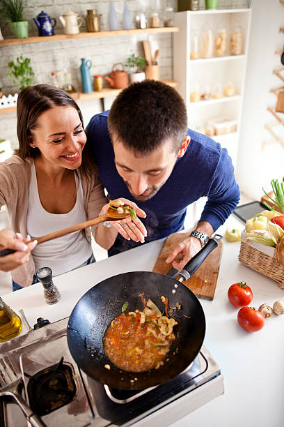 istock young couple cooking together 580090450