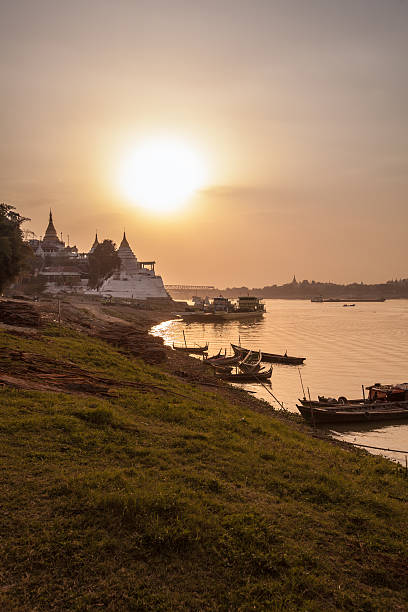 istock Burmese boats at dusk 580090714