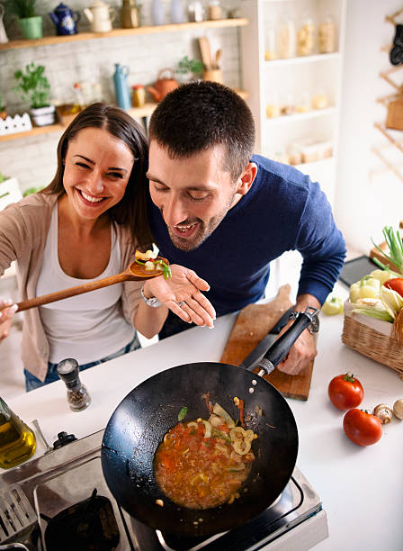 istock young couple cooking together 580092186