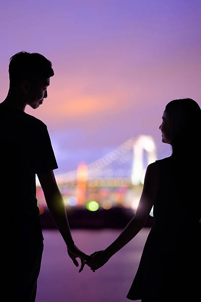 istock silhouette romantic lovers with Odaiba 580093496