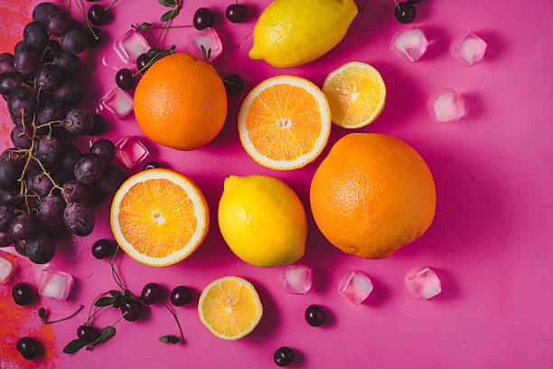 istock Fruit mix on the bright pink background top view 580093898