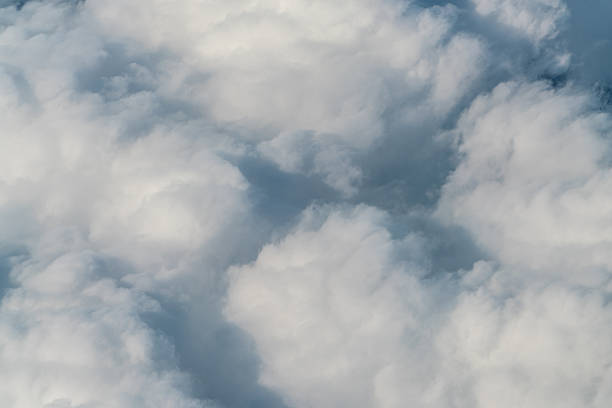 istock Clouds and sky as seen through window of an aircraft 580094010