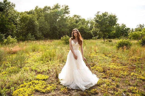 istock portrait of red-haired bride in the forest 580096640
