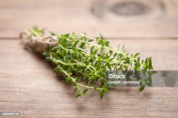 Close Up Of Fresh Thyme On Old Wooden Table Stock Photo - Download Image Now - Thyme, Close-up, Food