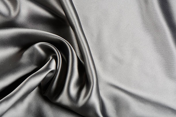 istock Effects of light in one gray satin fabric 580099510