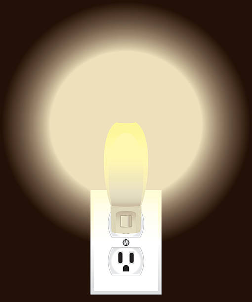 Night Light Night light is plugged into electrical outlet and turned on electric plug dark stock illustrations