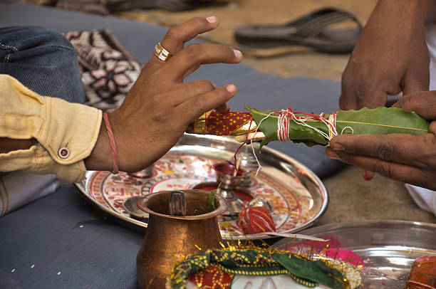 istock Indian Hand Performing Indian Rituals For His Wedding 580100328