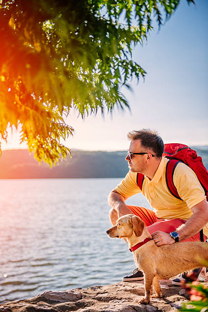 istock Man and dog by the sea 580102088