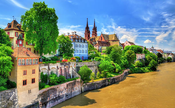 Old town of Basel with the cathedral above the Rhine Old town of Basel with the cathedral above the Rhine river - Switzerland basel switzerland photos stock pictures, royalty-free photos & images