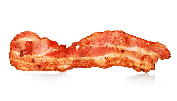 istock Cooked bacon rashers close-up isolated on a white background. 580107064