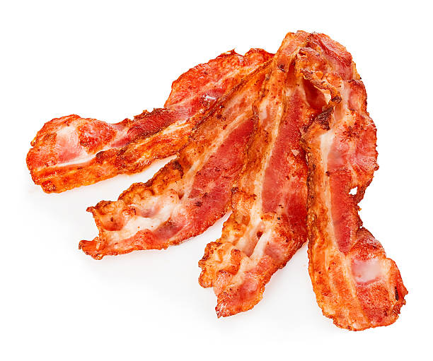 istock Cooked bacon rashers close-up isolated on a white background. 580107110