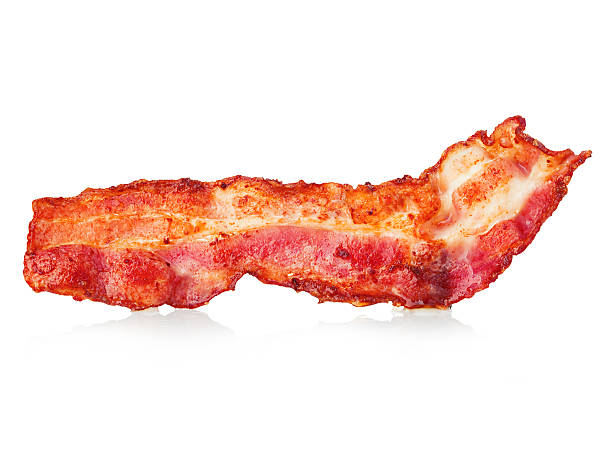 istock Cooked bacon rashers close-up isolated on a white background. 580107144
