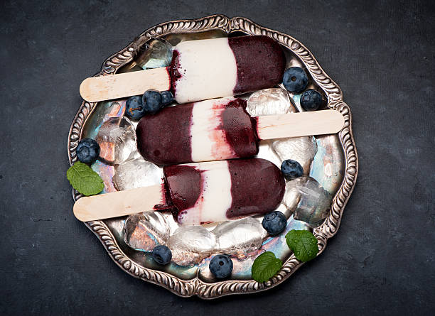 Ice cream sorbet with blueberries on a vintage silver plate