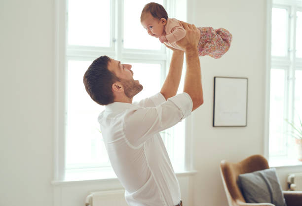 istock Up goes daddy's little girl! 580108064