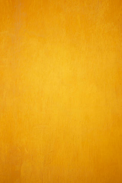 istock Yellow grunge cement wall, textured background. 580108084